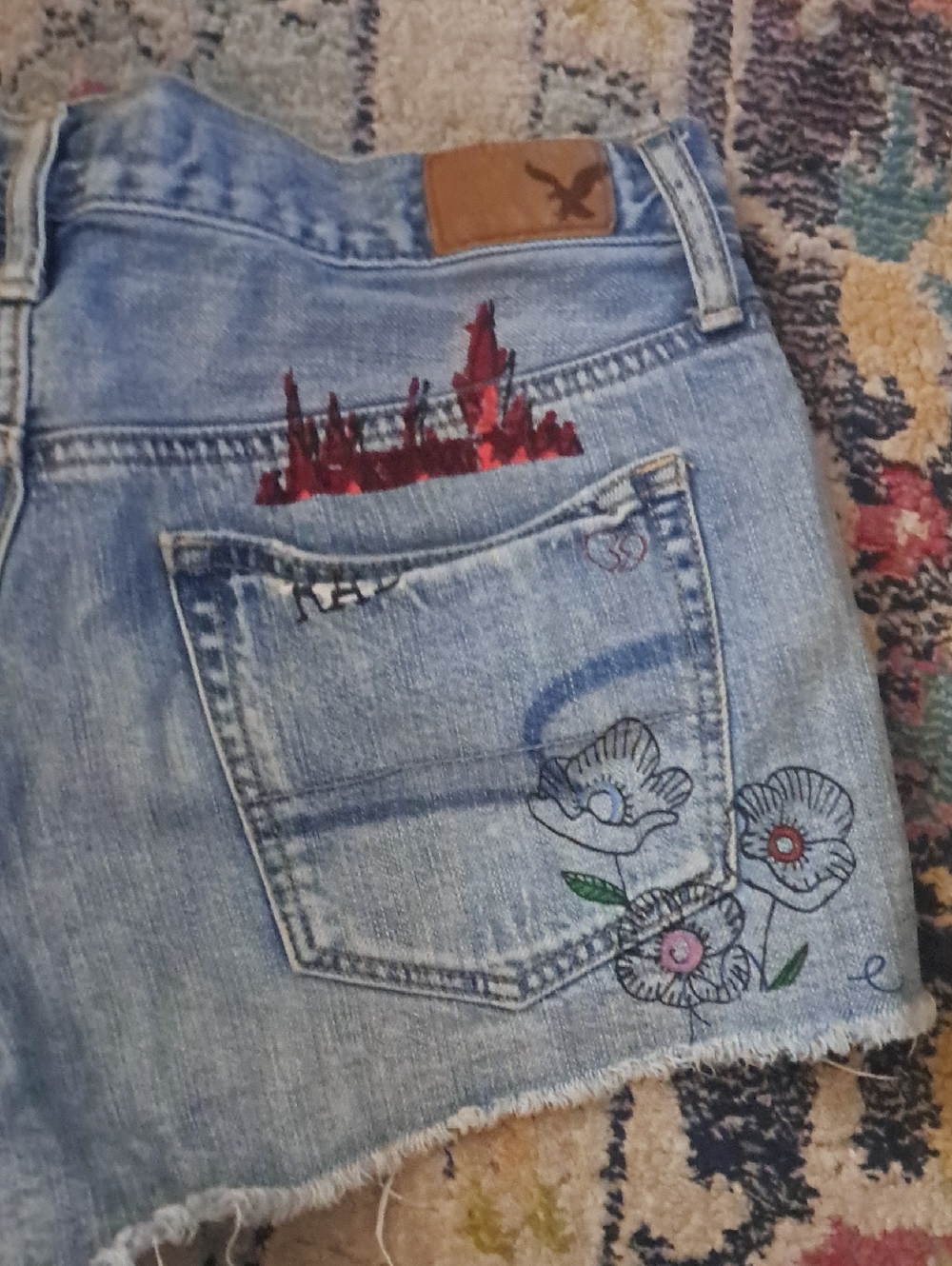 American Eagle Light Blue Distressed Denim Shorts with Sketchbook Graphics, Sz 6 - Picture 3 of 9